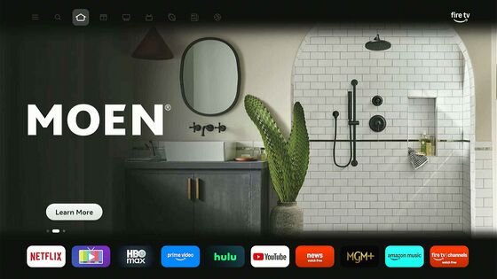 New 2026 interface: a large advertisement fills the home screen & installed apps drop to a single row along the bottom.[6]
