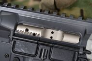 AR-15 bolt carrier group, which locks the breech.[16]
