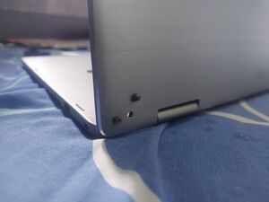 Drilling holes through the back lid, and screwing it with the holes in the hinge proves to be far sturdier than plastic and mini screws.